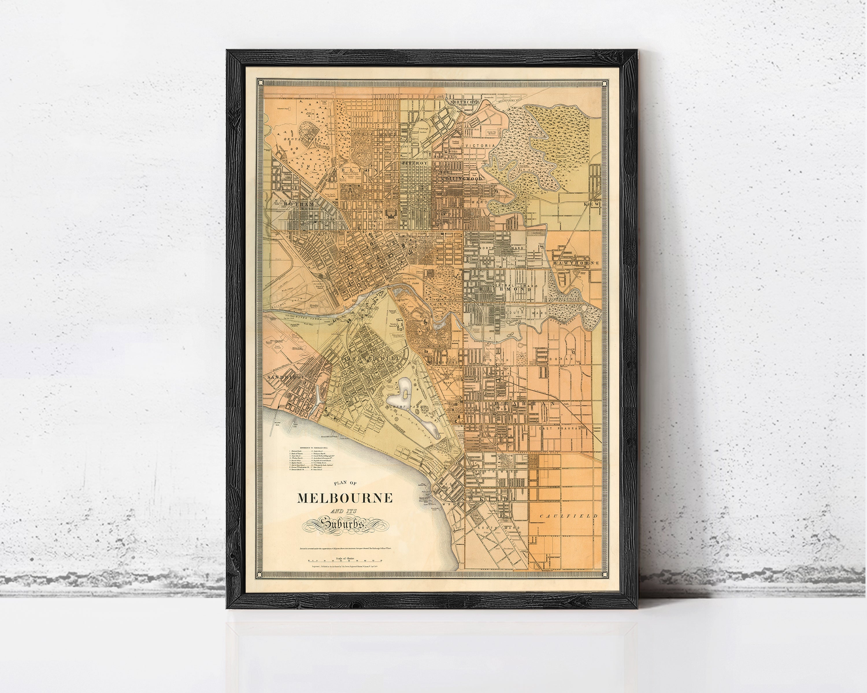 The image is a framed vintage map of Melbourne, Australia, depicting the city's layout and surrounding areas.