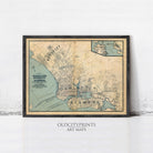 a framed map of old city prints on a wall