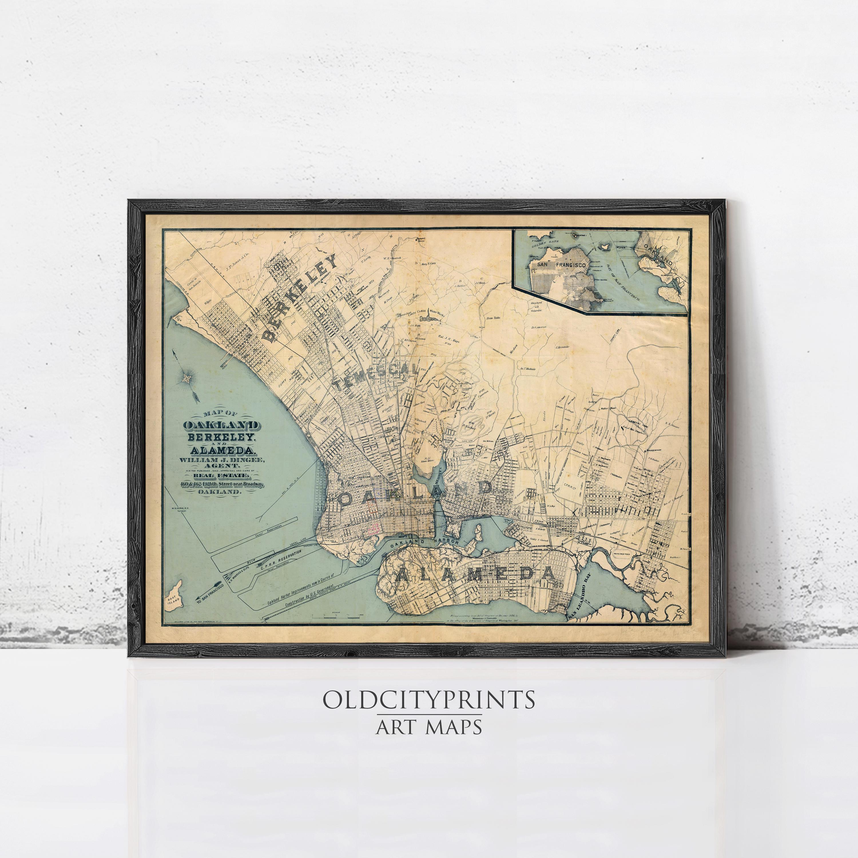 a framed map of old city prints on a wall