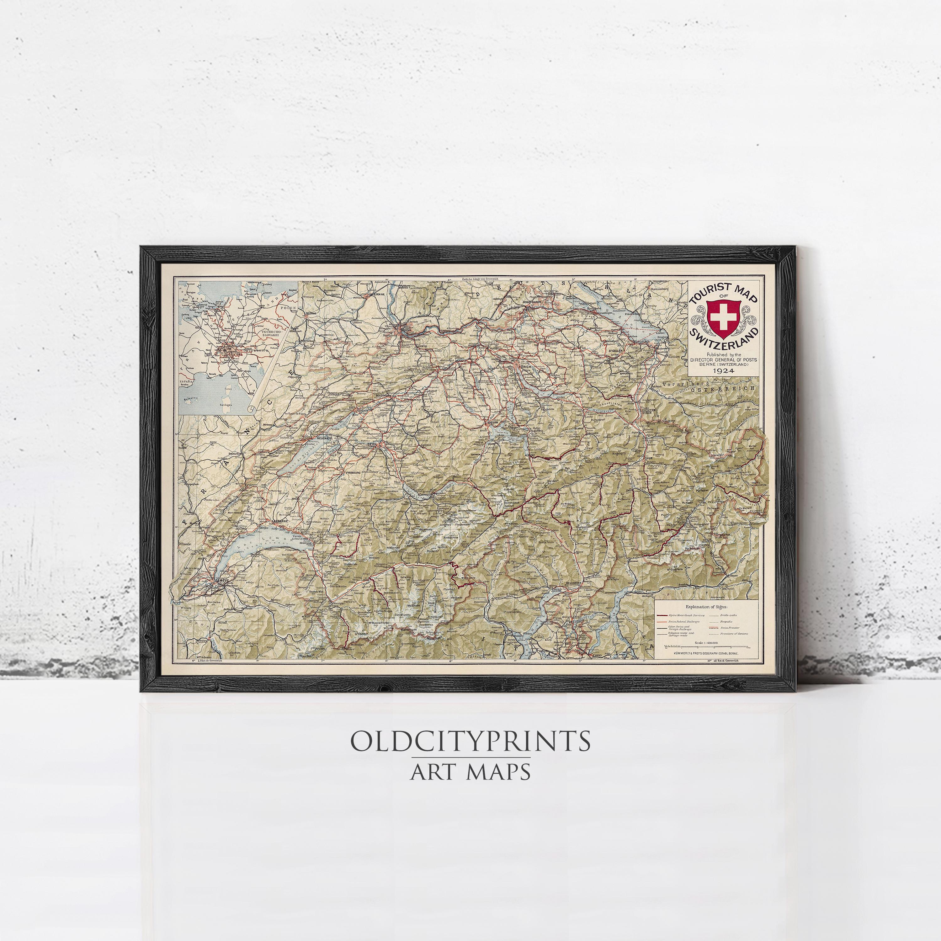 The image is a framed art map of Switzerland, featuring detailed geographical information and a Swiss flag symbol.