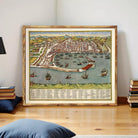 The image is a framed painting depicting a cityscape with boats and ships in the harbor.