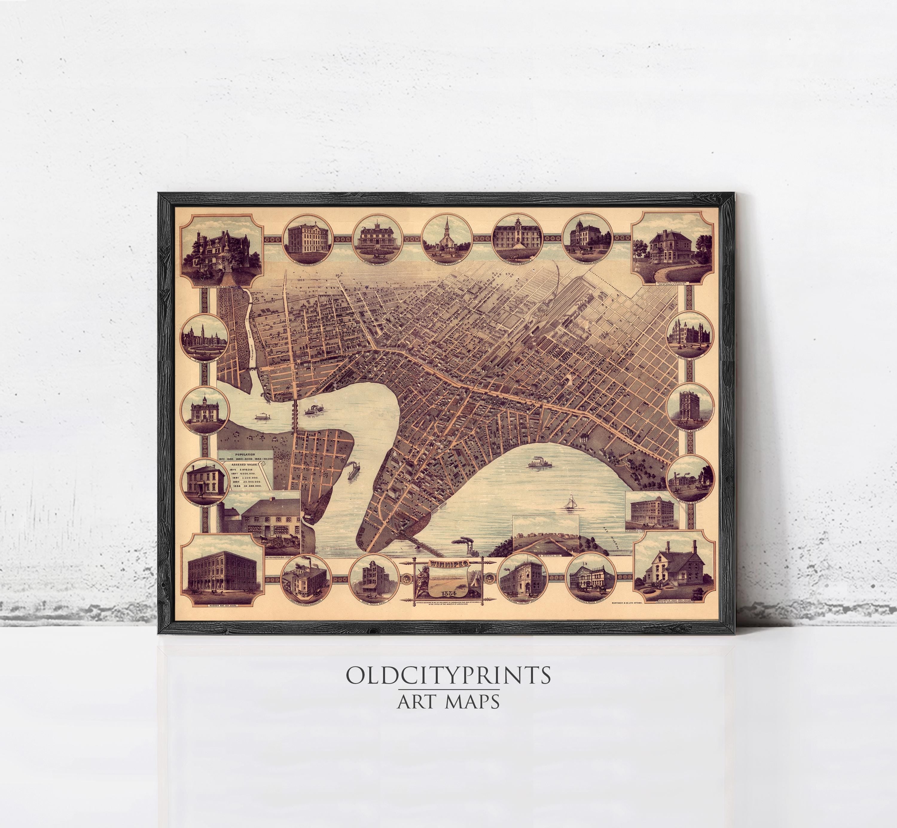 The image is a framed art print depicting a detailed map of a city, with various landmarks and buildings represented in a vintage style.
