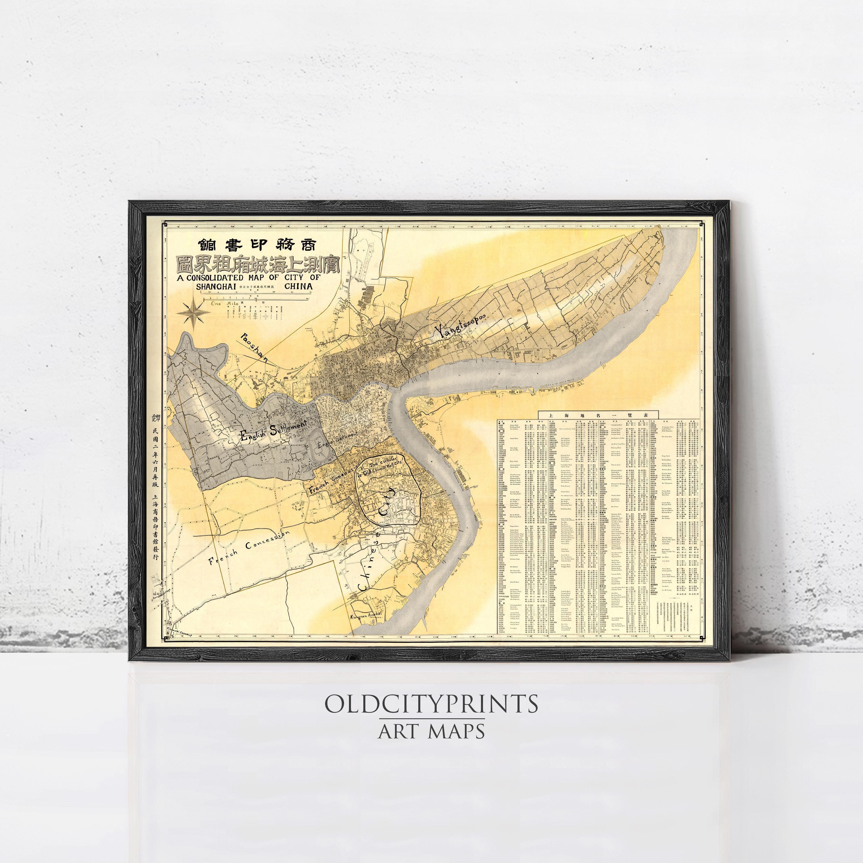 The image is a framed vintage map of a city, likely from the late 19th century, with detailed cartography and labels.
