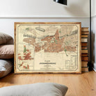 a framed map of Johannesburg, South Africa, with a wooden frame and a vintage appearance.
