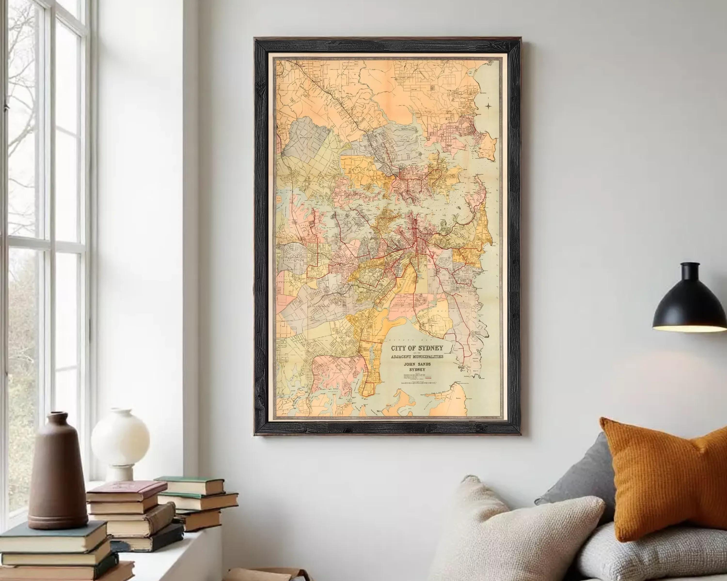 The image is a framed vintage map of the city of Sydney, Australia, depicting the city's streets and surrounding areas.