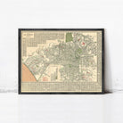 The image is a framed vintage map of Los Angeles, California, depicting the city's streets and neighborhoods in a detailed and detailed manner.