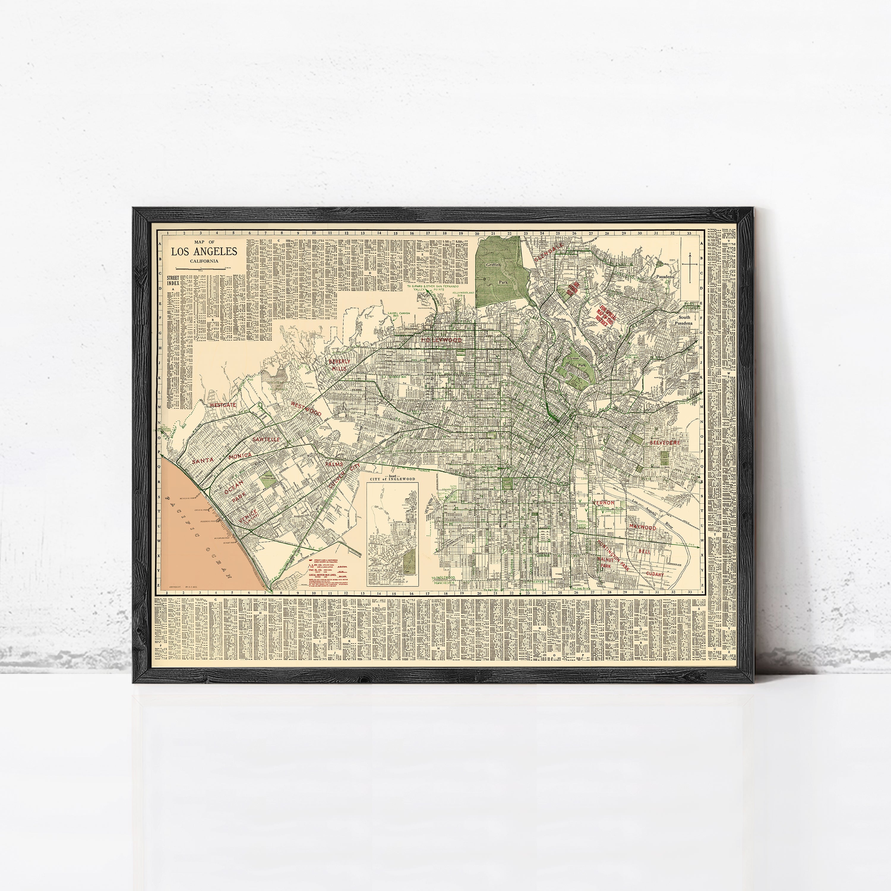 The image is a framed vintage map of Los Angeles, California, depicting the city's streets and neighborhoods in a detailed and detailed manner.