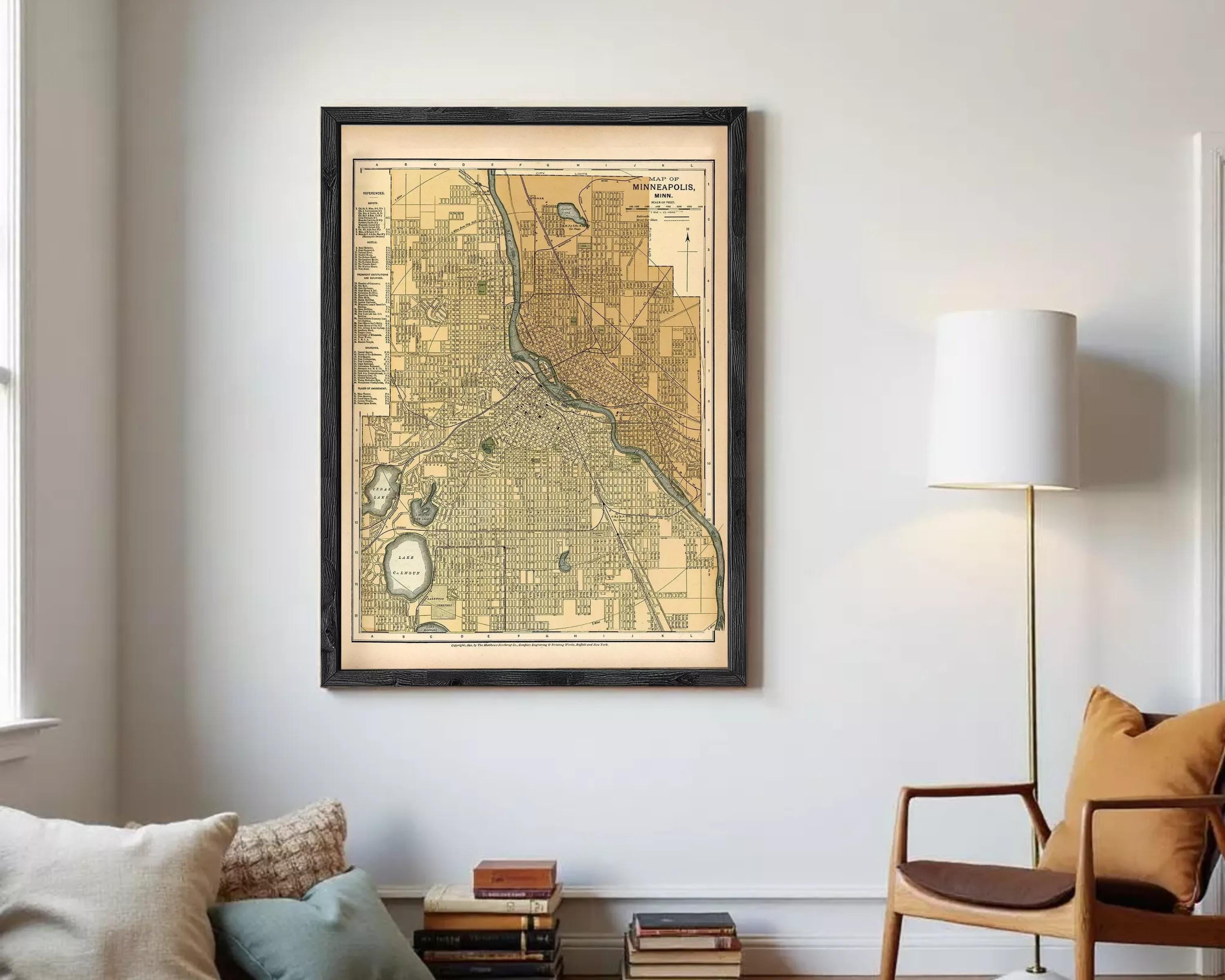 The image is a framed map of Minneapolis, Minnesota, depicting the city's streets and surrounding areas.