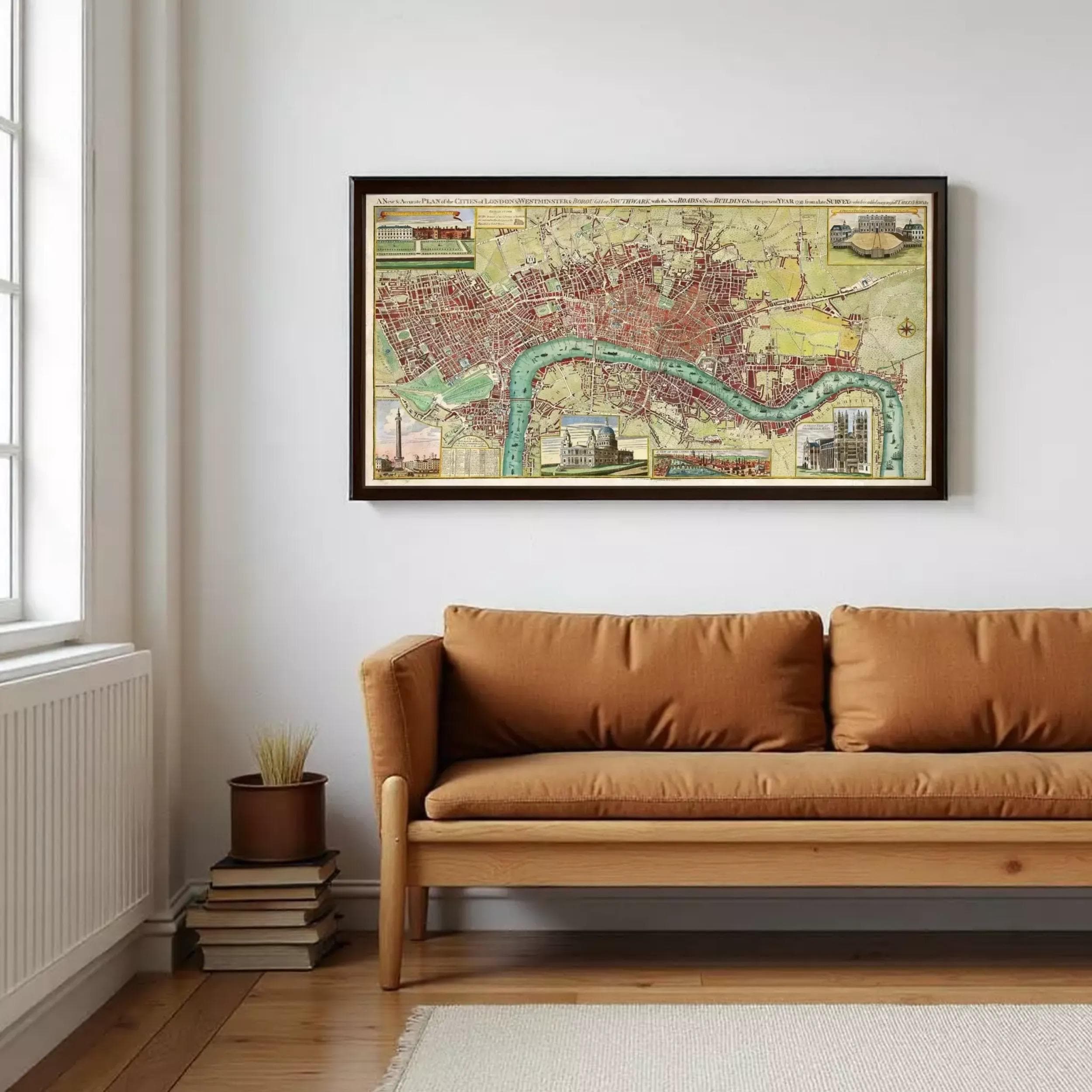 a large framed map of London hanging on a white wall above a brown sofa in a cozy living room setting.