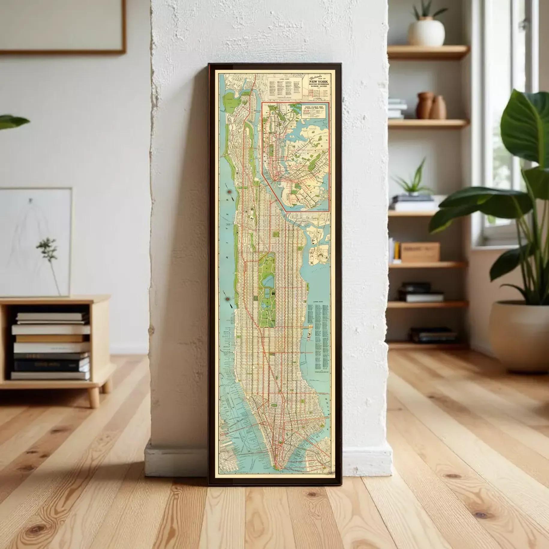 A framed map of New York City is displayed on a wall in a room with a bookshelf and potted plants in the background.