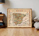 The image is a framed map of Spain, with various symbols and labels indicating different regions and zones within the country.