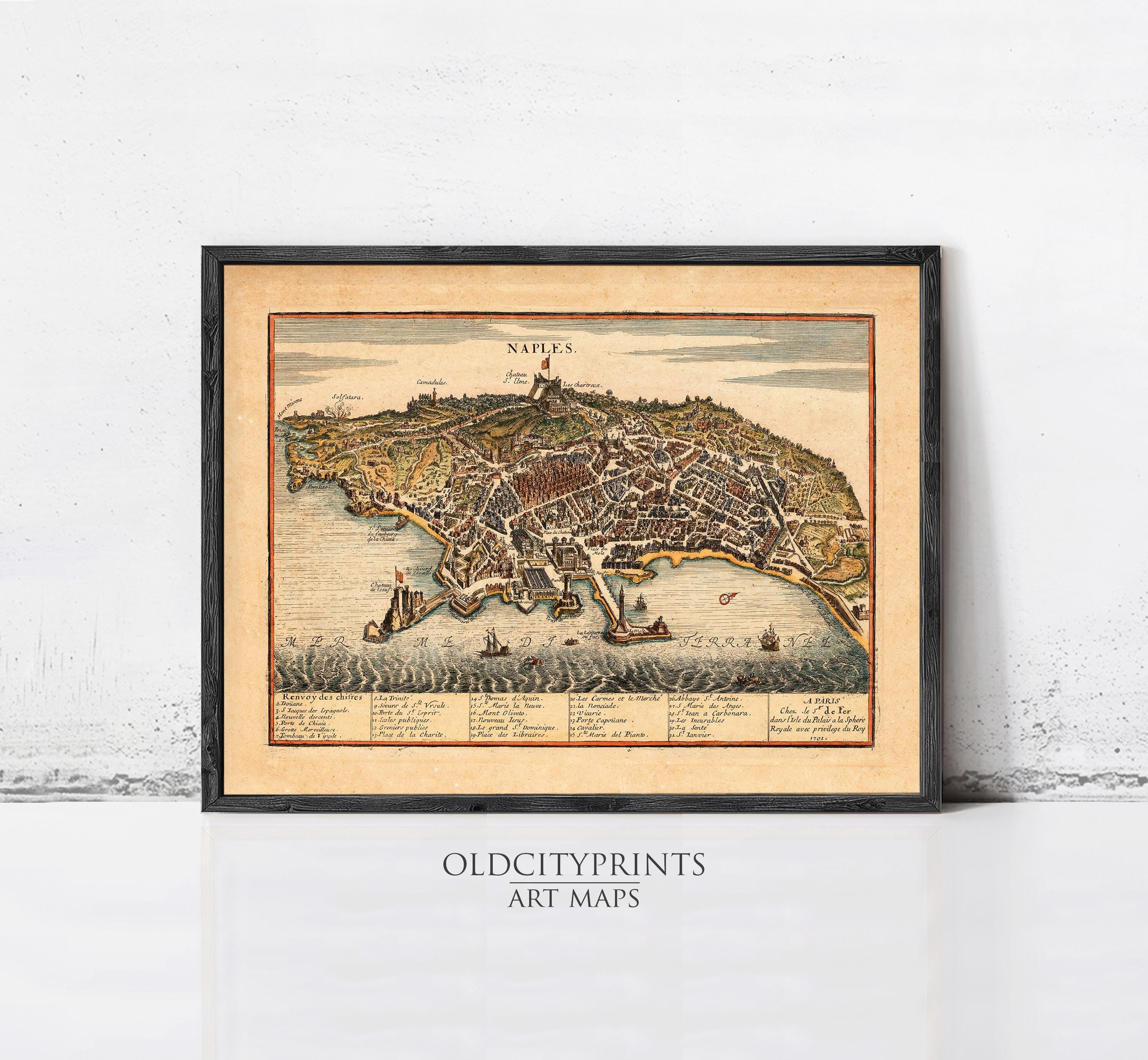 The image is a framed vintage map of Naples, Italy, depicting the city's layout and surrounding areas.