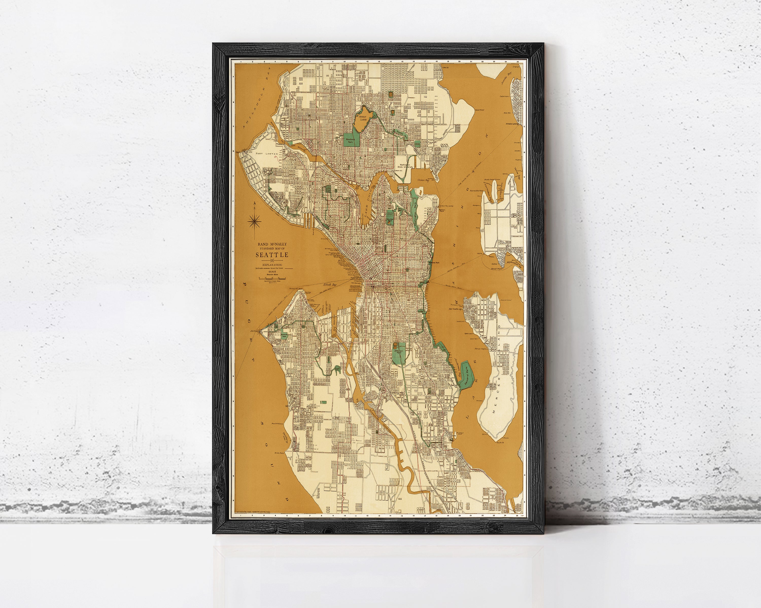 The image is a framed map of Seattle, Washington, with a yellow and brown color scheme.