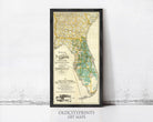 The image is a framed vintage map of Florida, depicting the state's geographical layout and boundaries.