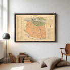 The image is a framed vintage map of a city, likely Paris, with various streets, landmarks, and a legend.