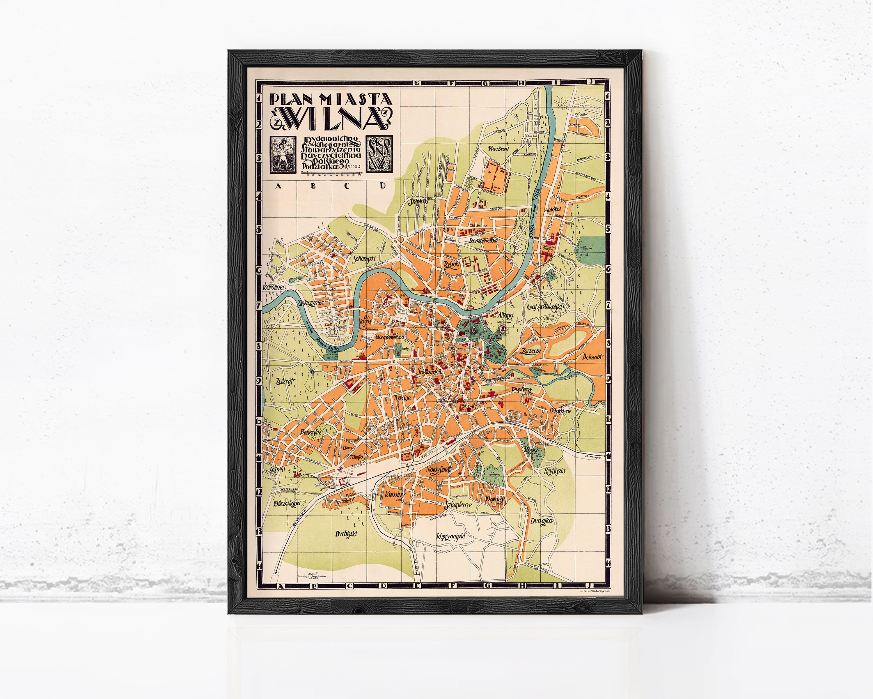 The image is a framed vintage map of Milan, Italy, depicting the city's layout and surrounding areas.