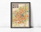 The image is a framed vintage map of Milan, Italy, depicting the city's layout and surrounding areas.