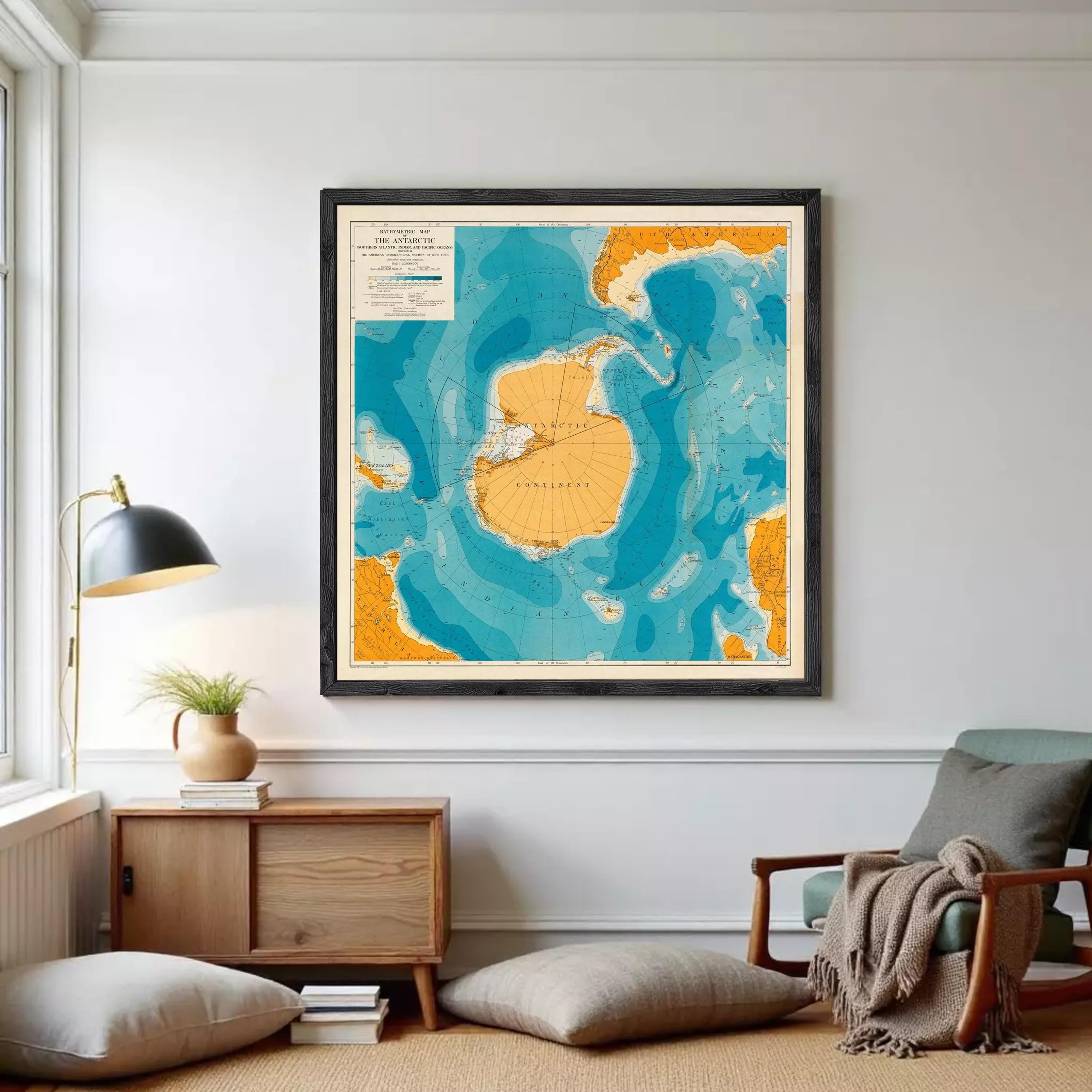 The image is a framed map of the Antarctic continent, showing the surrounding waters and landmasses in a stylized and colorful manner.