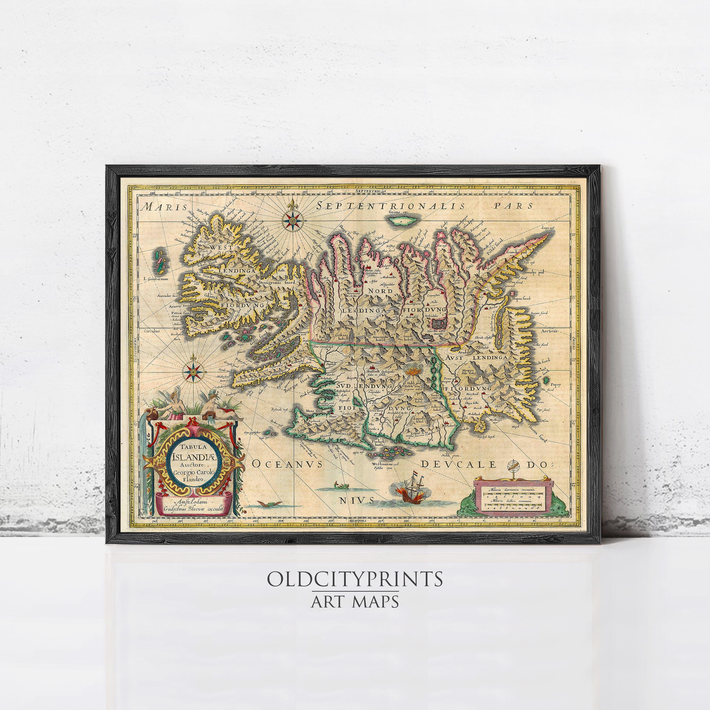 The image is a framed vintage map of Iceland, featuring intricate details and a decorative border.