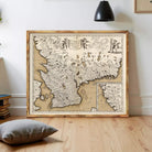 The image is a framed antique map of Europe, likely from the 16th century, with detailed cartography and illustrations.