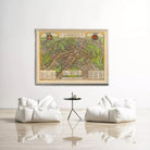 a large framed map of Cambridge hanging on a white wall, with two white bean bag chairs positioned in front of it.