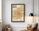 The image is a framed vintage map of Milan, Italy, depicting the city's layout and surrounding areas.