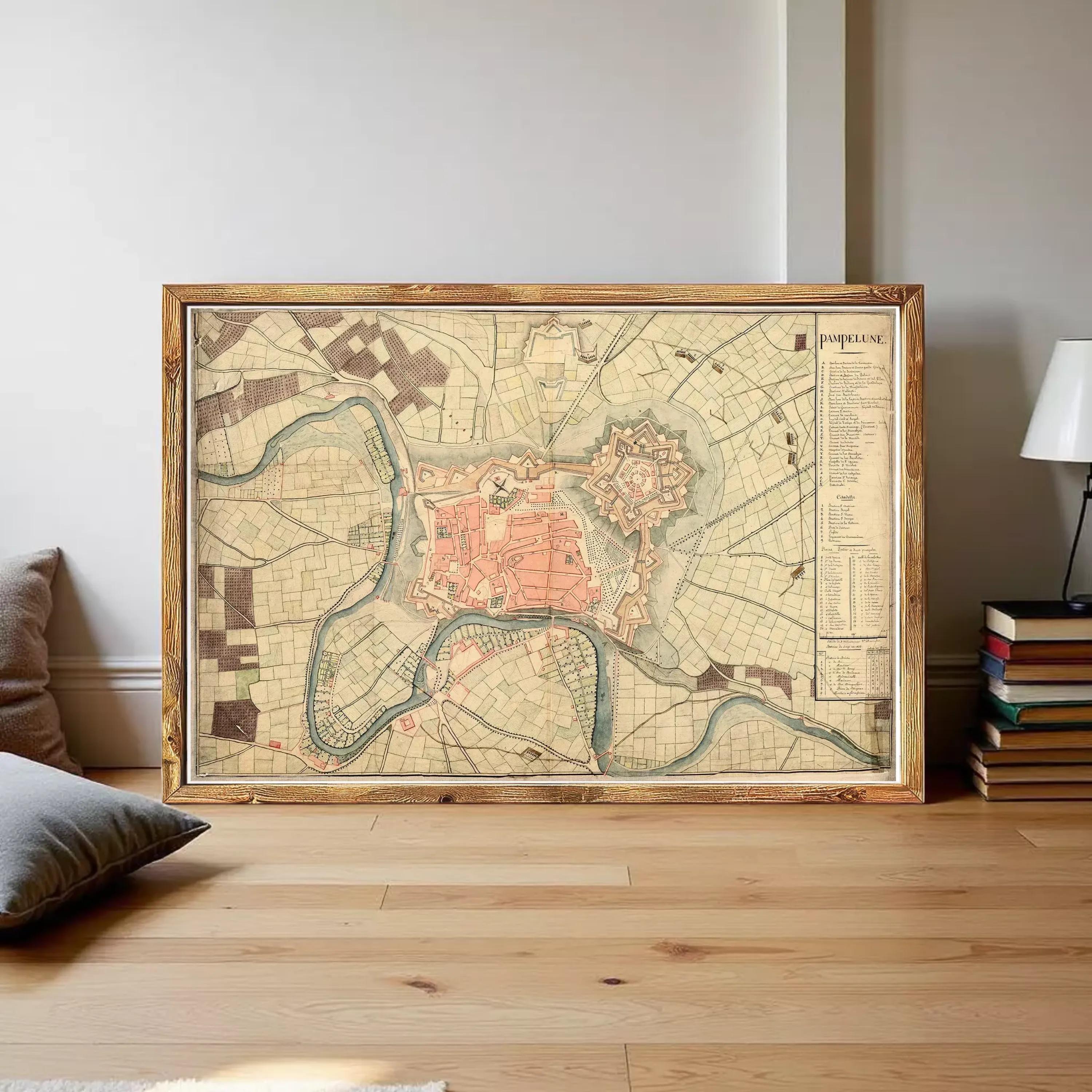 The image is a framed historical map of a city, likely Paris, with various landmarks and streets depicted.