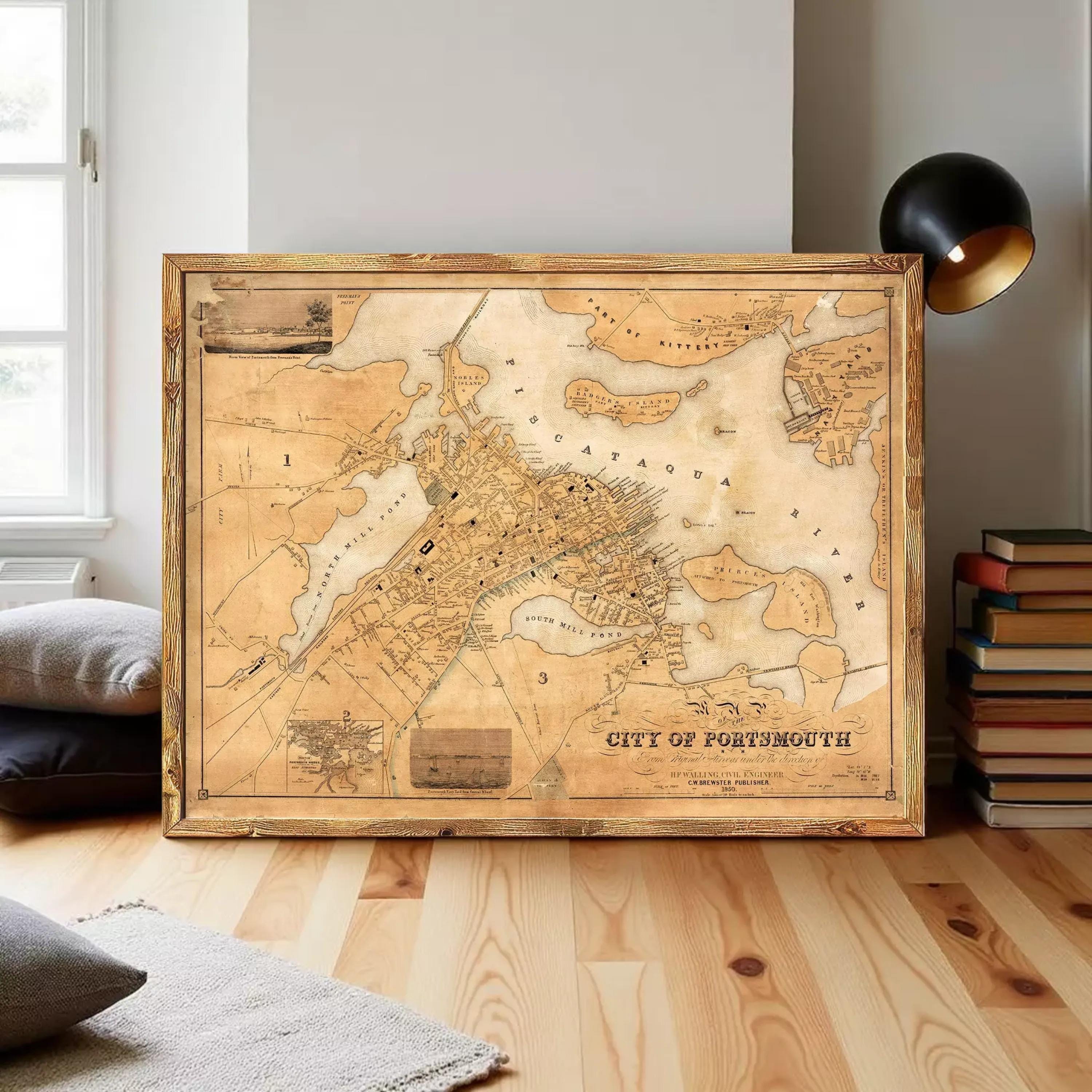 a large, antique map of the city of Portsmouth, New Hampshire, with a wooden frame and a black lamp in the background.