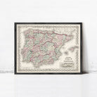 A framed vintage map of Spain and Portugal, with a decorative border around the edges.