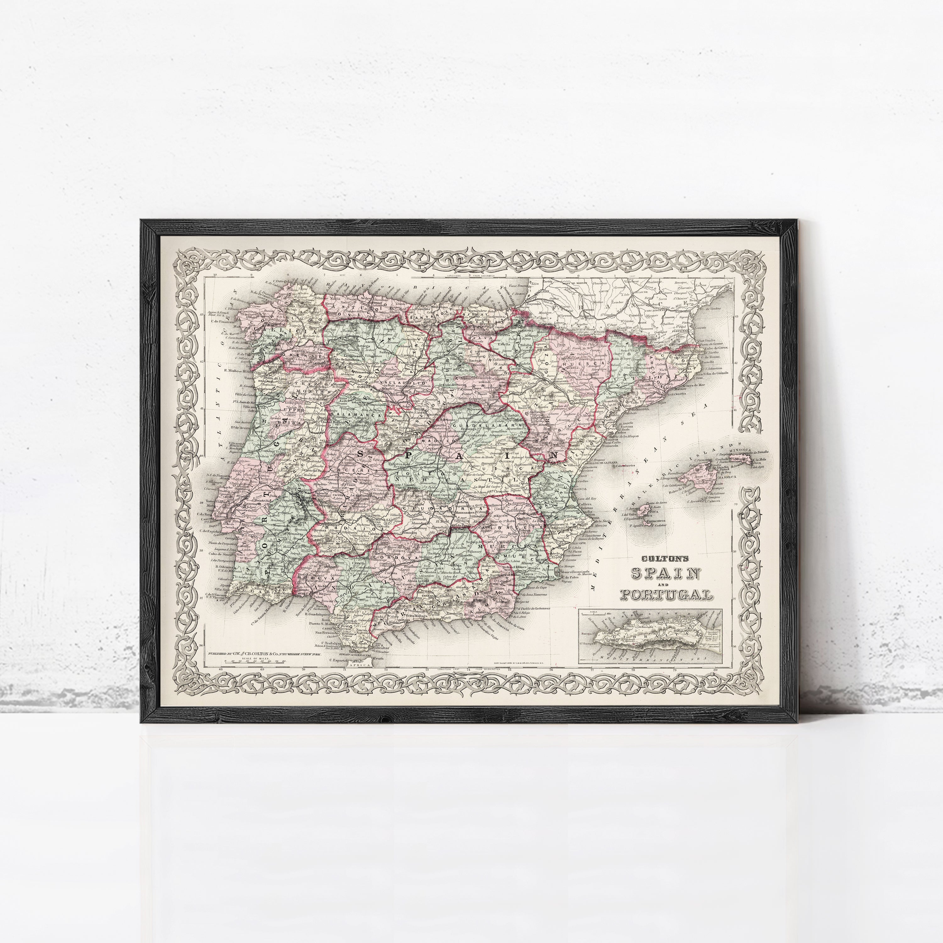 A framed vintage map of Spain and Portugal, with a decorative border around the edges.