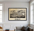 a large framed map of Thaca, New York, hanging on a wall in a living room.
