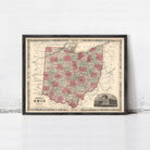 The image is a framed vintage map of Ohio, featuring a detailed and colorful depiction of the state's geography and surrounding areas.