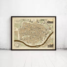 The image is a framed map of a city, likely a historical or geographical map, displayed on a white wall.