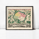 The image is a framed vintage map of a city, depicting a detailed layout of the city's streets, buildings, and other landmarks.