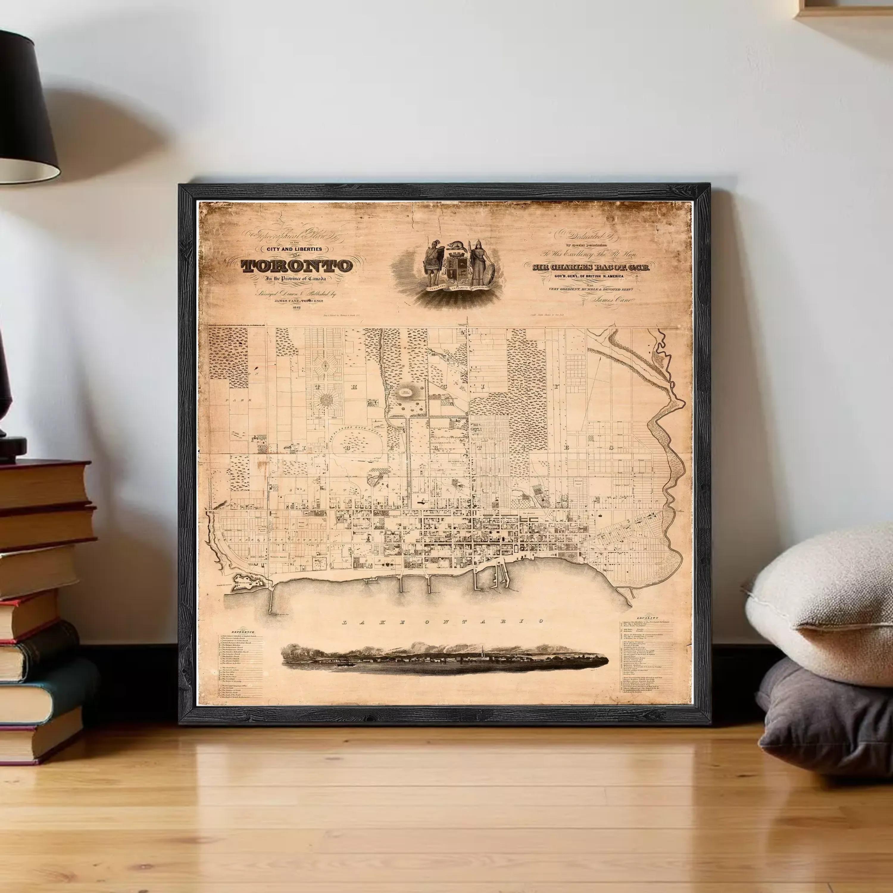 The image is a framed vintage map of Toronto, Canada, depicting the city's layout and surrounding areas.