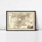 The image is a framed antique map of a city, likely from the 18th century, depicting a detailed layout of the city and surrounding areas.