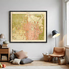 a large framed map of a city hanging on a wall in a living room.