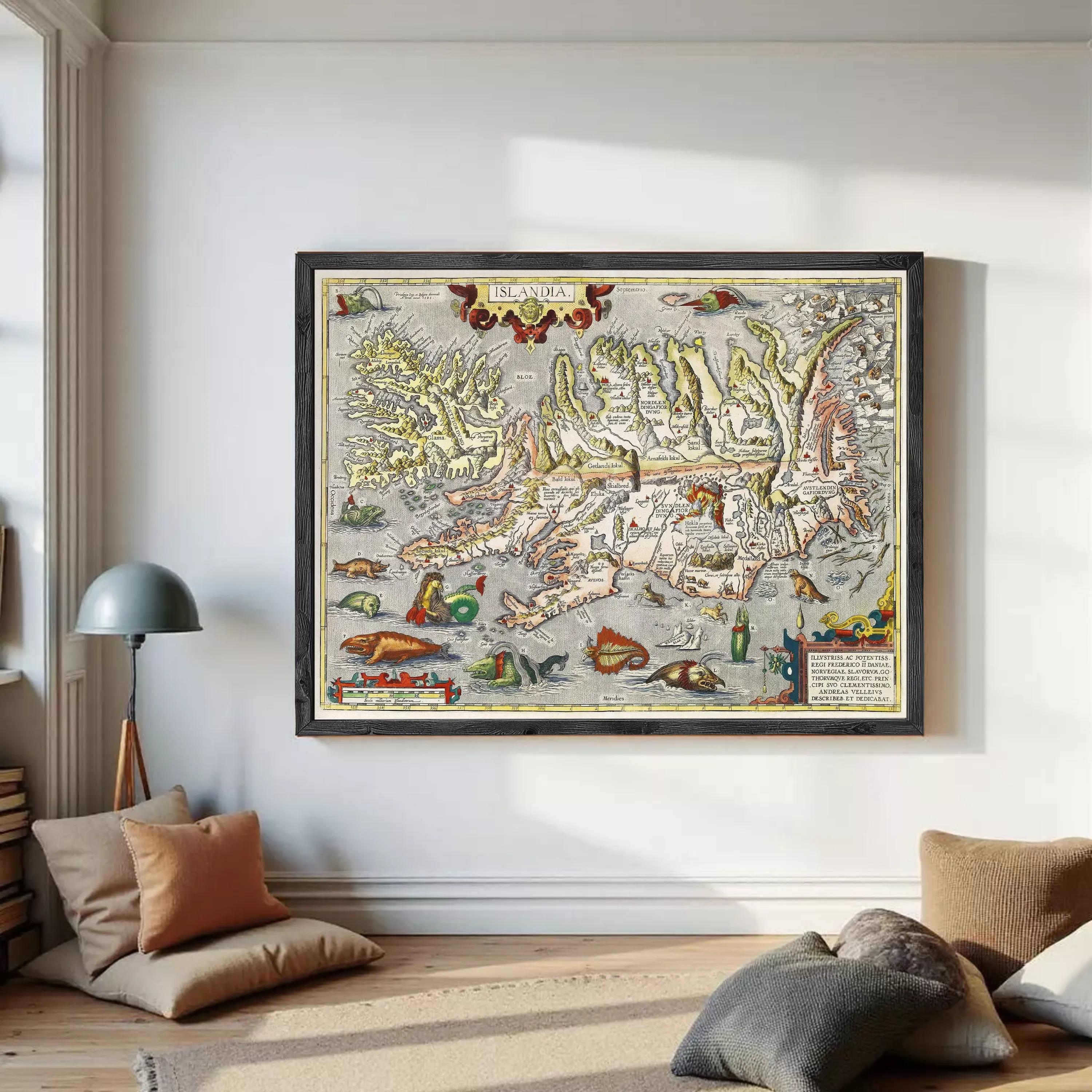 The image is a framed vintage map of Iceland, featuring intricate illustrations and detailed geographical information.
