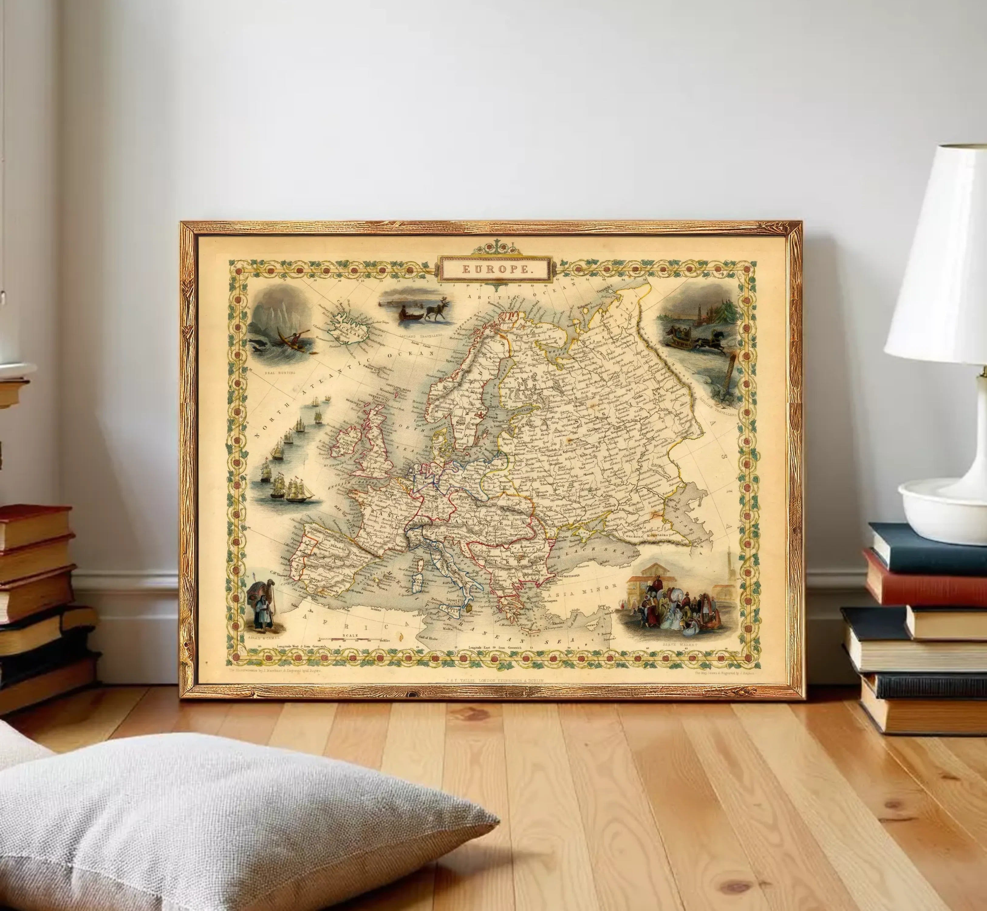 The image is a framed vintage map of Europe, depicting various landmarks and regions across the continent.