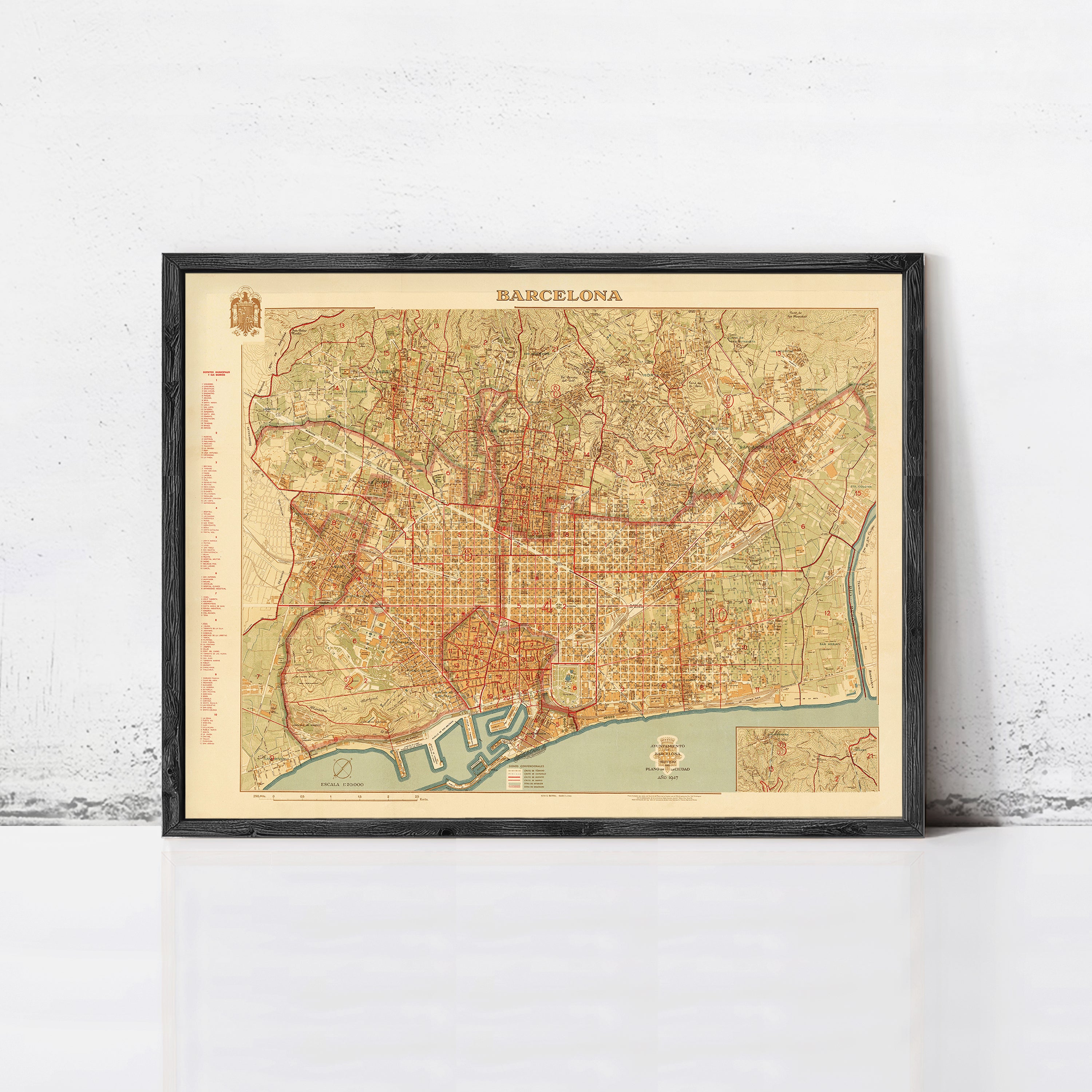 The image is a framed vintage map of Barcelona, Spain, depicting the city's streets and landmarks.