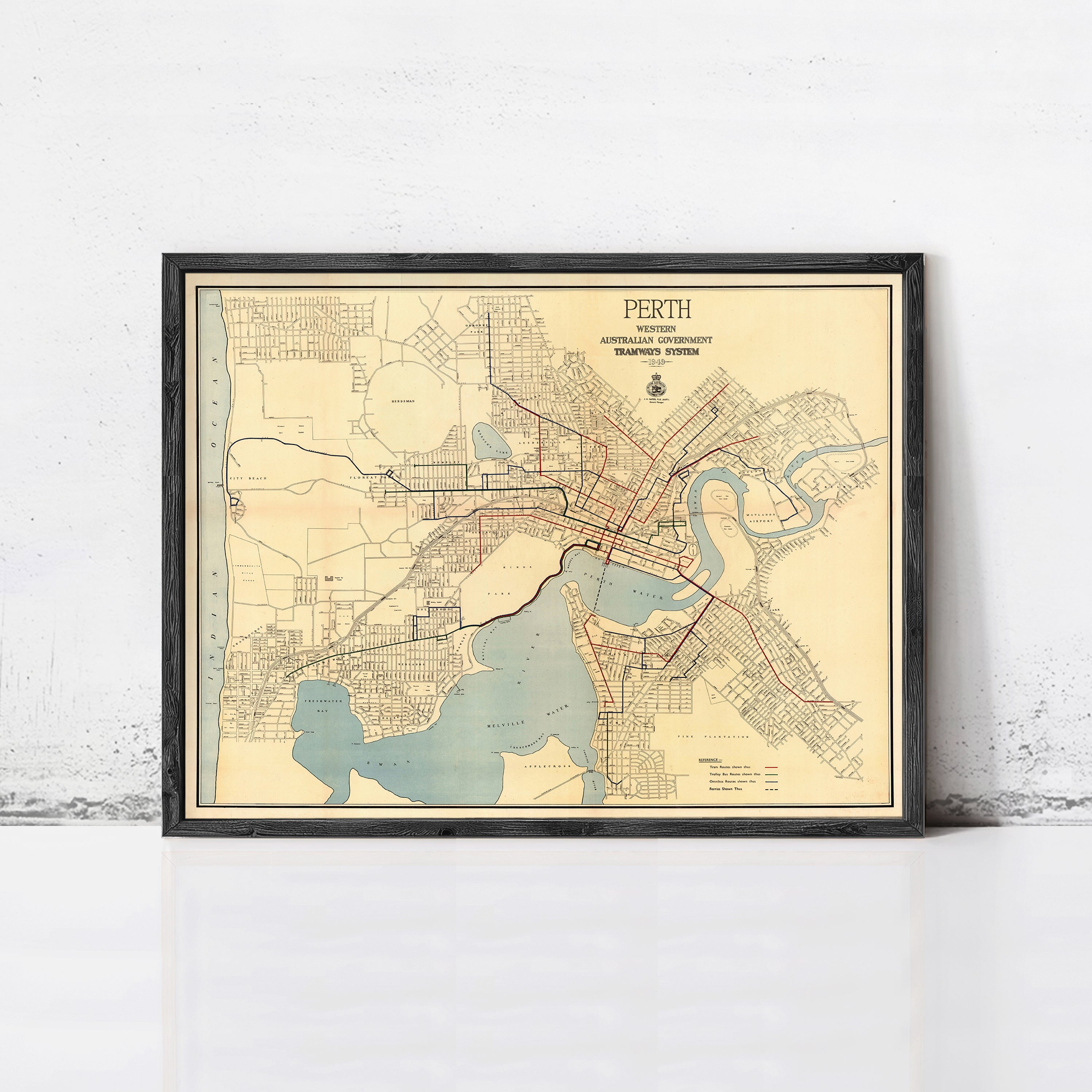 The image is a framed vintage map of the city of Perth, Australia, depicting the city's streets, waterways, and surrounding areas.