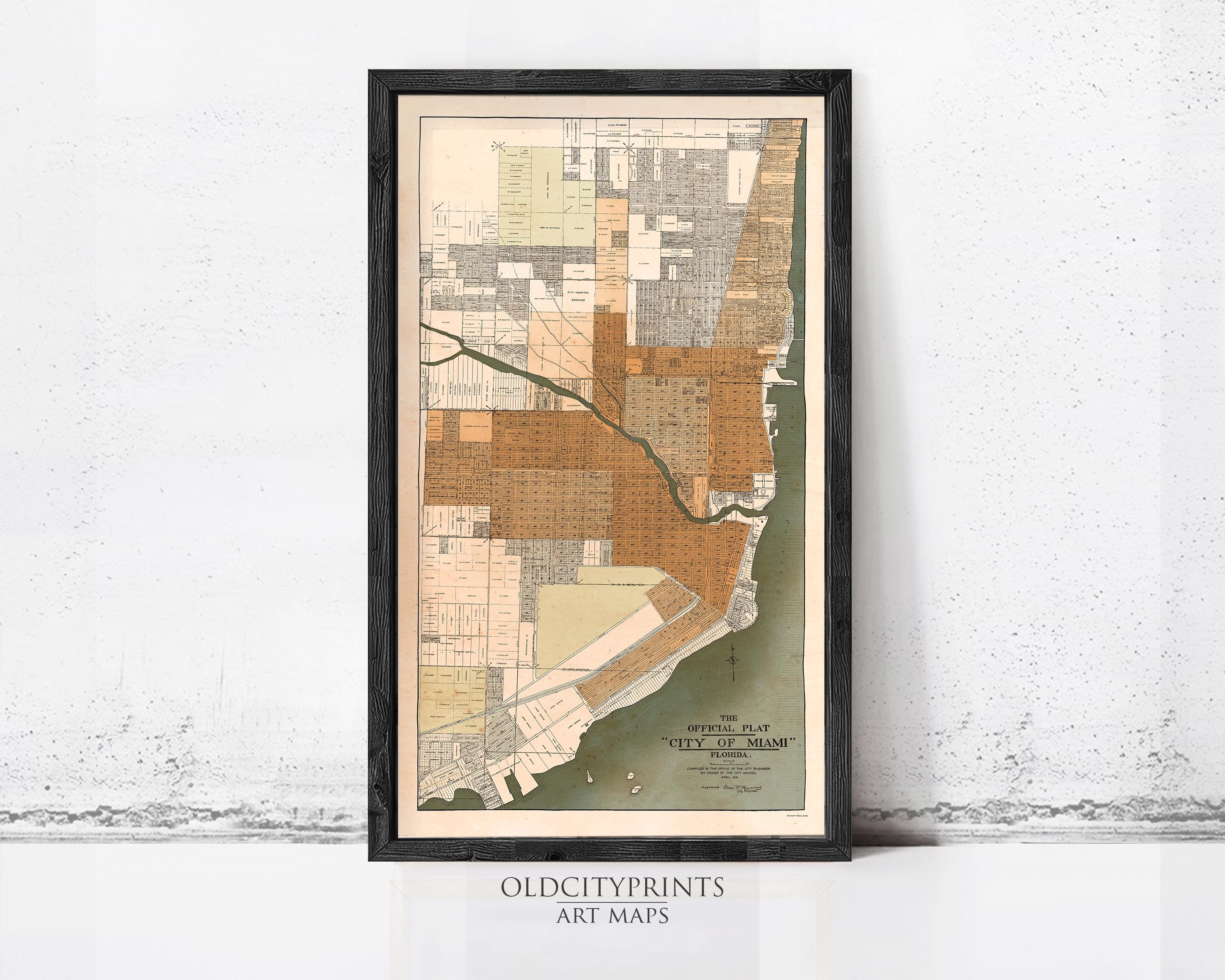 The image is a framed vintage map of Miami, Florida, depicting the city's layout and surrounding areas.