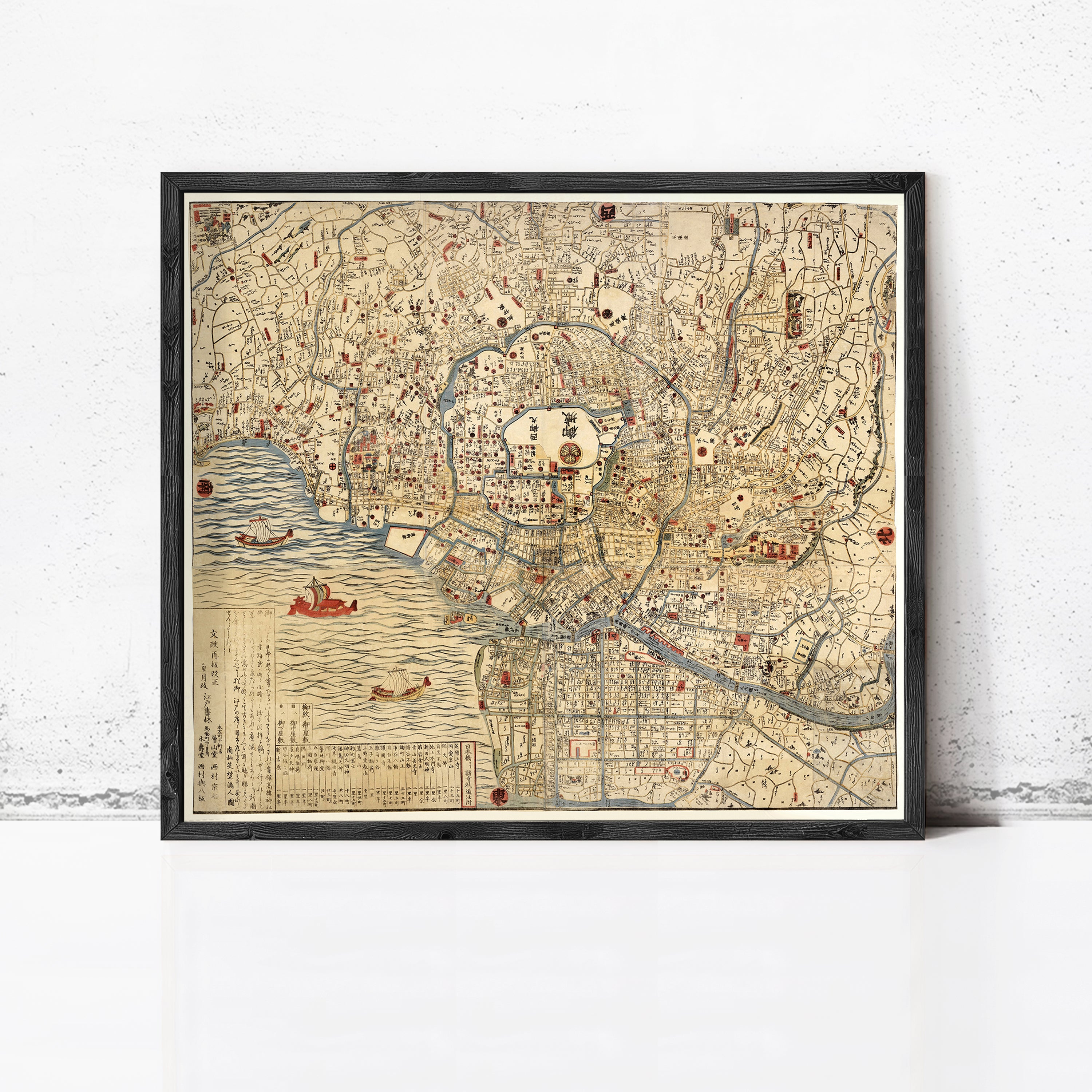 The image is a framed vintage map of Tokyo, Japan, depicting various landmarks and geographical features.