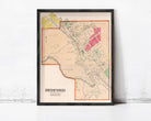 A framed map of Bedford, New Jersey, with various colored areas and streets labeled.