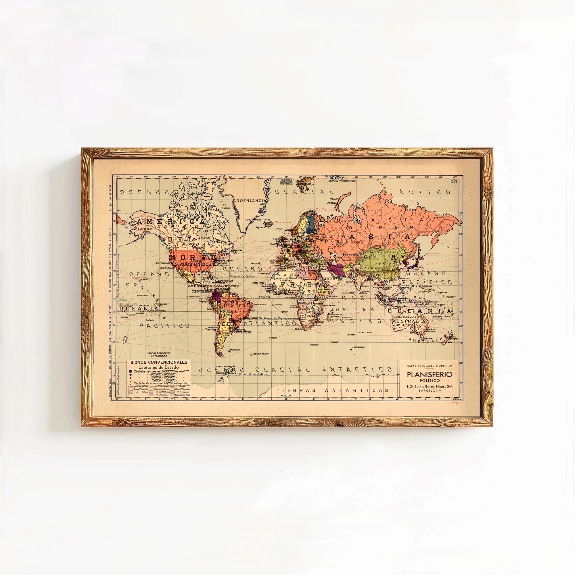 The image is a framed vintage world map depicting the continents and oceans in a color palette of orange, pink, and green.