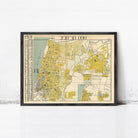 The image is a framed vintage map of a city, likely Jerusalem, with yellow and green coloring.