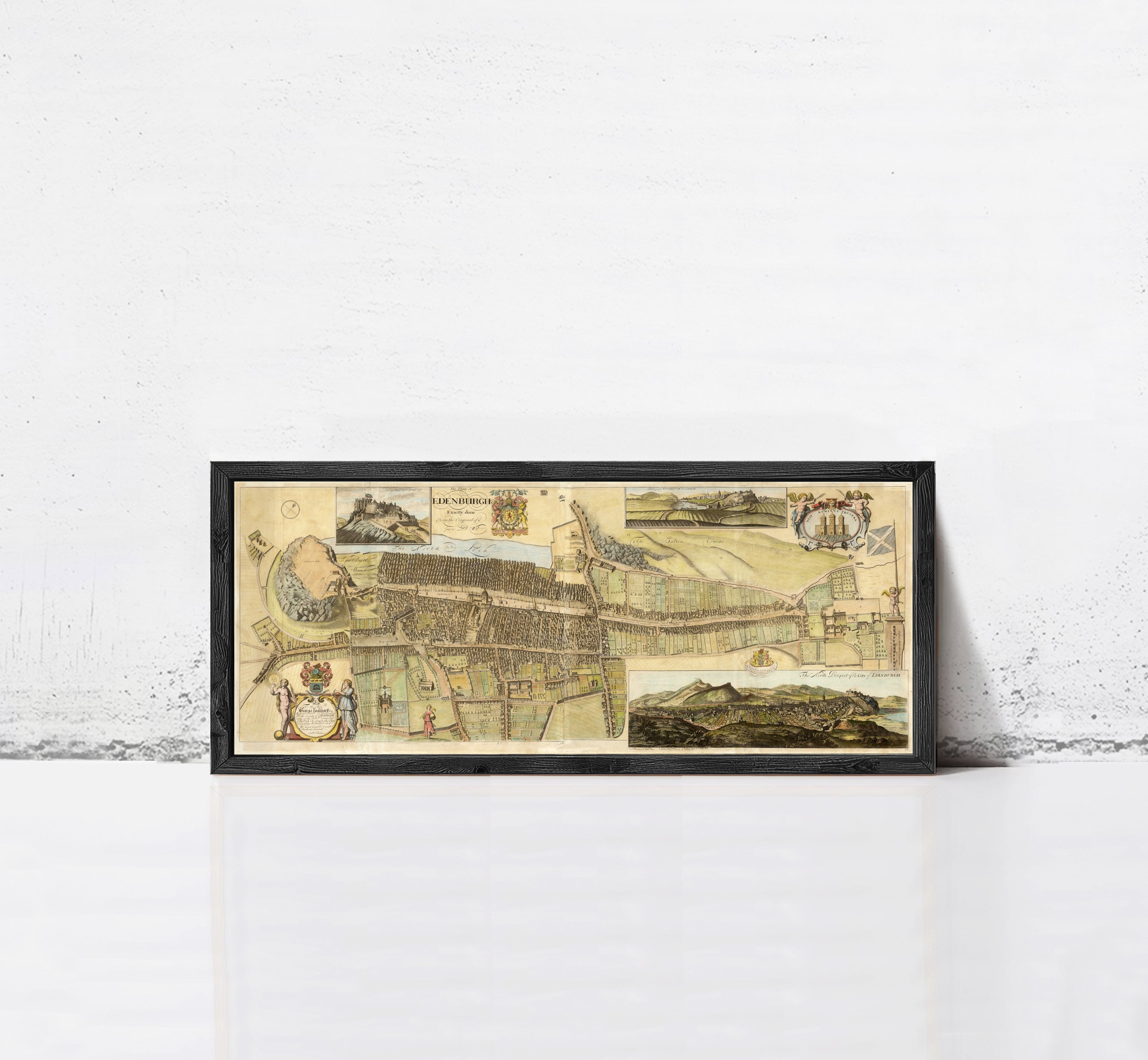The image is a framed collage of various images, including a map, a landscape, and a historical scene, all set against a white wall.