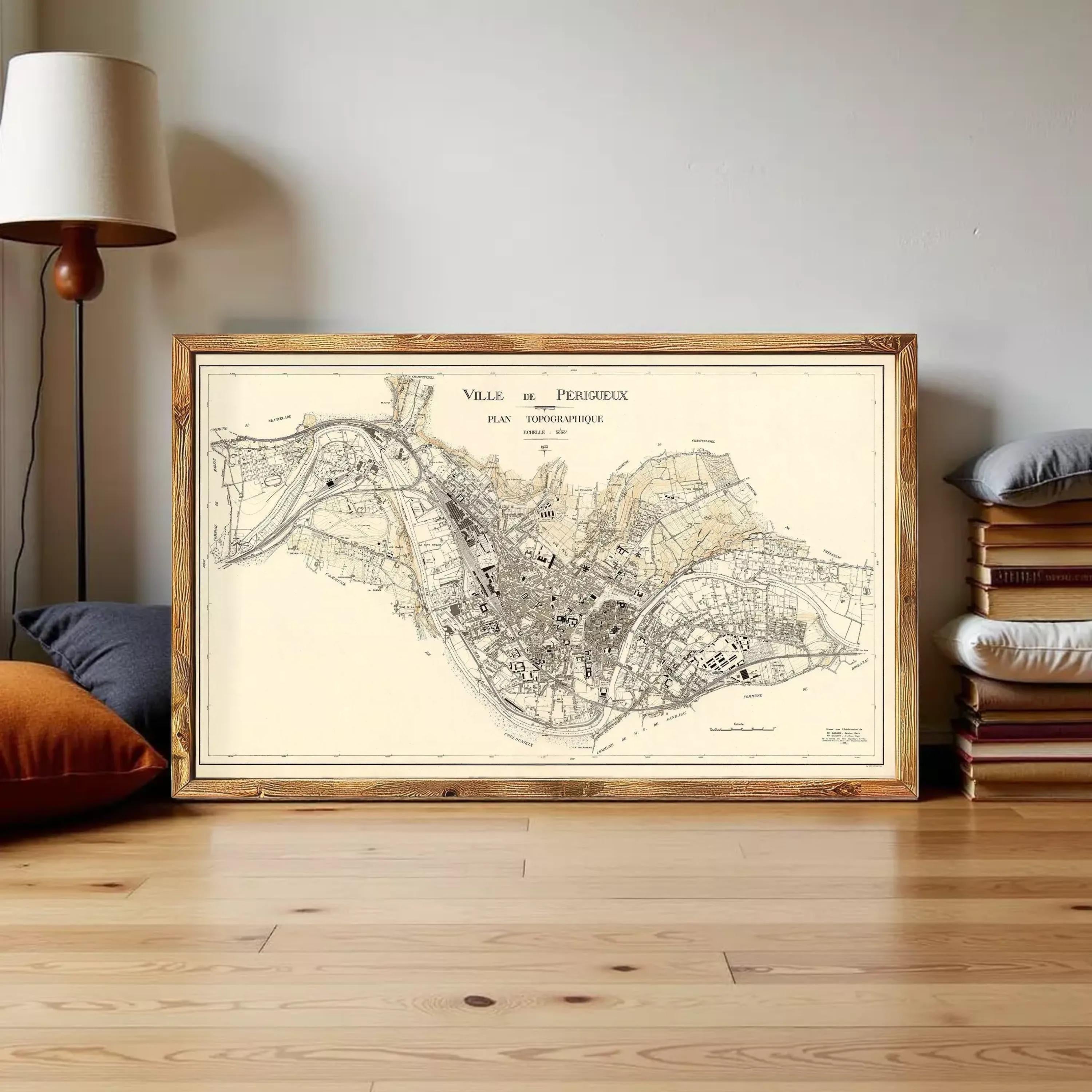The image is a framed vintage map of a city, likely Paris, with detailed street and area labels.