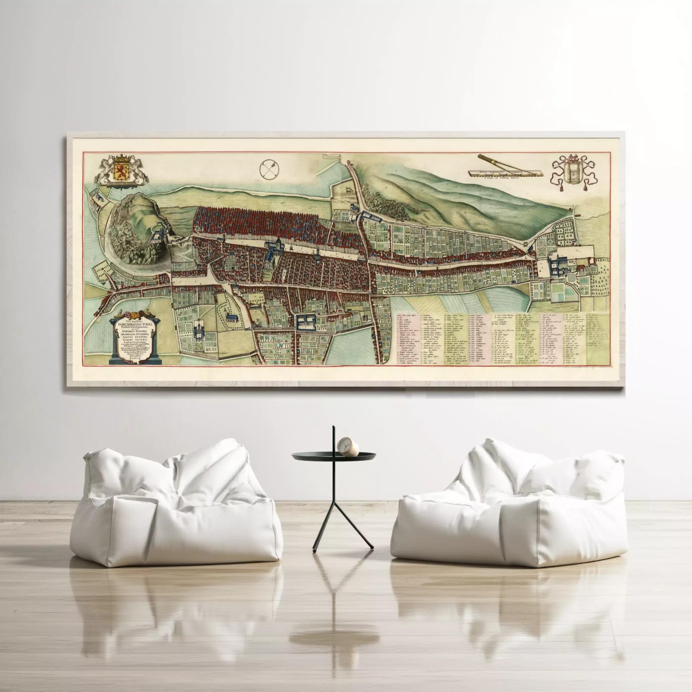 a large, detailed map of a city displayed on a wall, with two white bean bag chairs positioned in front of it.