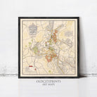 The image is a framed art print depicting a map of a city, with various streets, landmarks, and other geographical features.